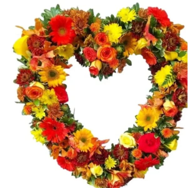 Heart-shaped floral wreath with red, yellow, and orange blooms