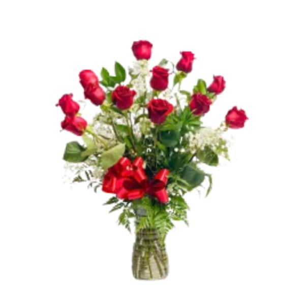 Red roses in a glass vase with a red ribbon