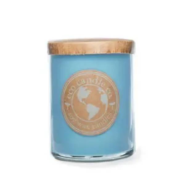 Blue candle in a glass jar with a wooden lid