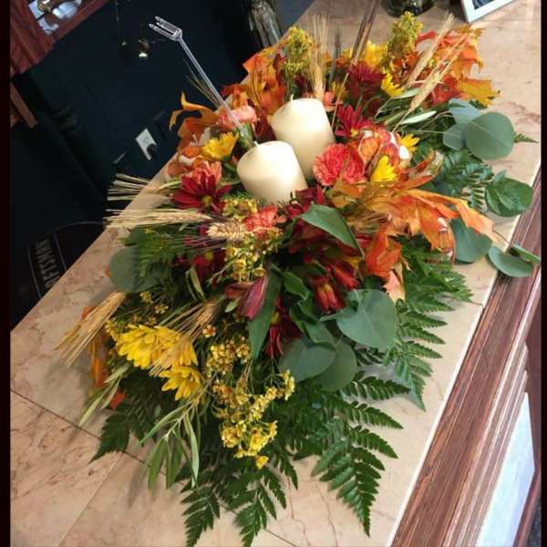 Autumn floral casket spray with candles and mixed flowers
