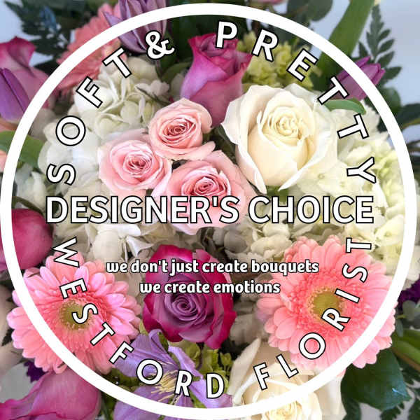 Pastel mixed bouquet of pink and white roses, gerbera daisies, and hydrangeas with designer's choice text overlay.