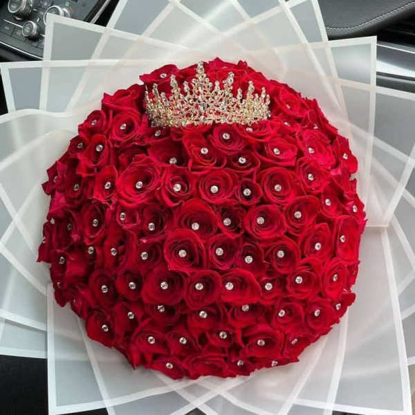 100 red roses, a color that symbolizes love and passion.
