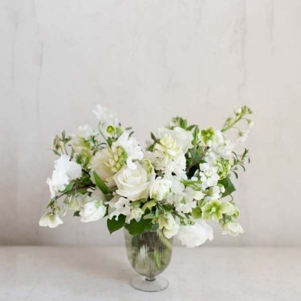 White floral arrangement in a clear glass vase