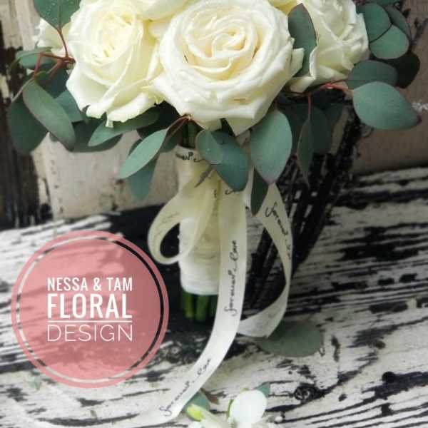 White rose bouquet with eucalyptus and ribbon