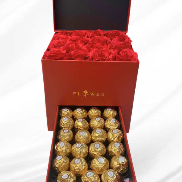 Red gift box with roses and gold-wrapped chocolates
