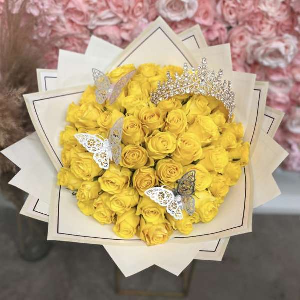 Yellow rose bouquet with butterfly picks and a jeweled tiara topper
