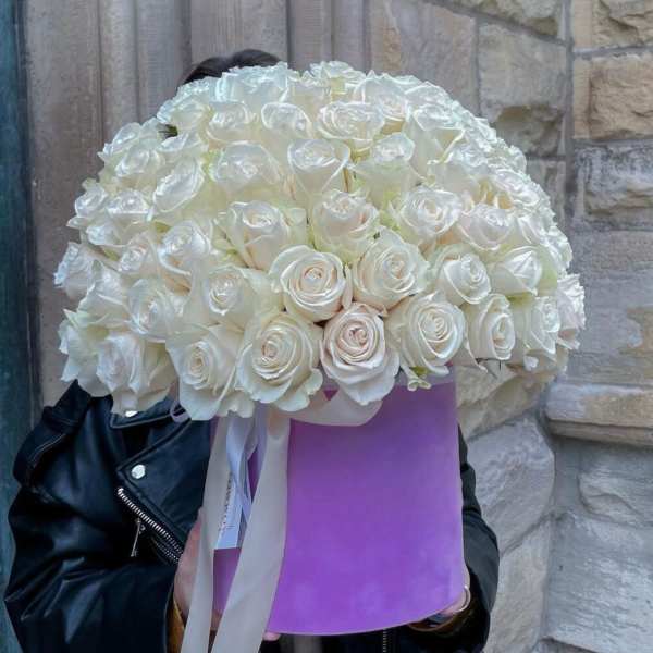 Large bouquet of white roses in a lavender hatbox with ribbon