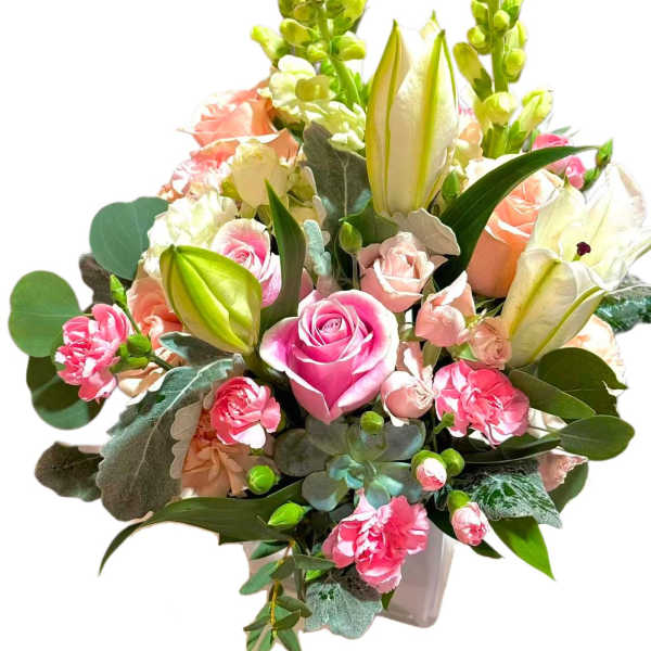 Pink and peach bouquet with roses, lilies, and carnations in a vase