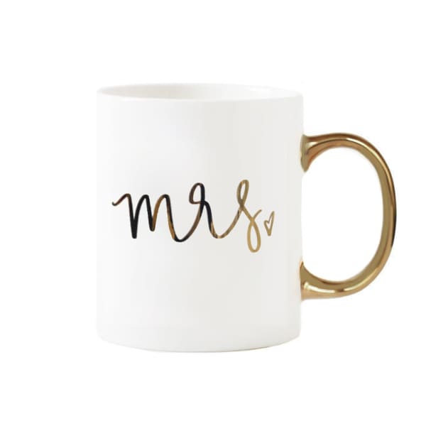 White mug with gold handle and "mrs" lettering