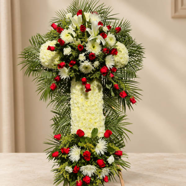 Standing floral cross with red roses and white flowers