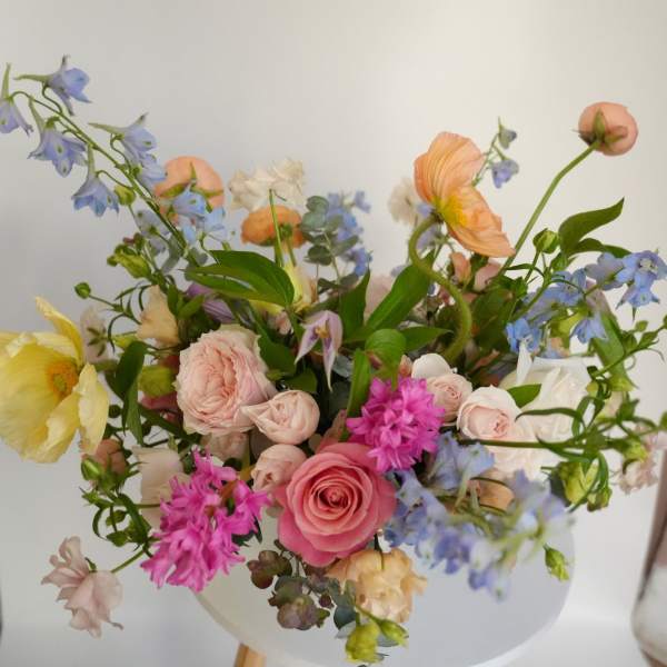 Mixed pastel bouquet in a white vase