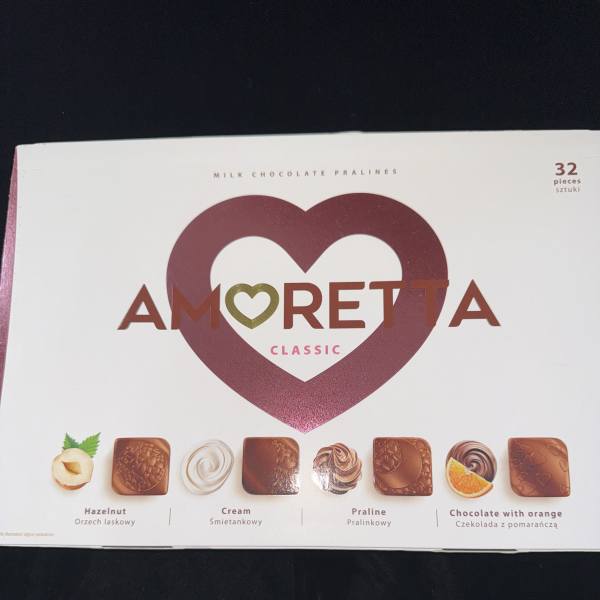 Box of Amoretta milk chocolate pralines with heart graphic