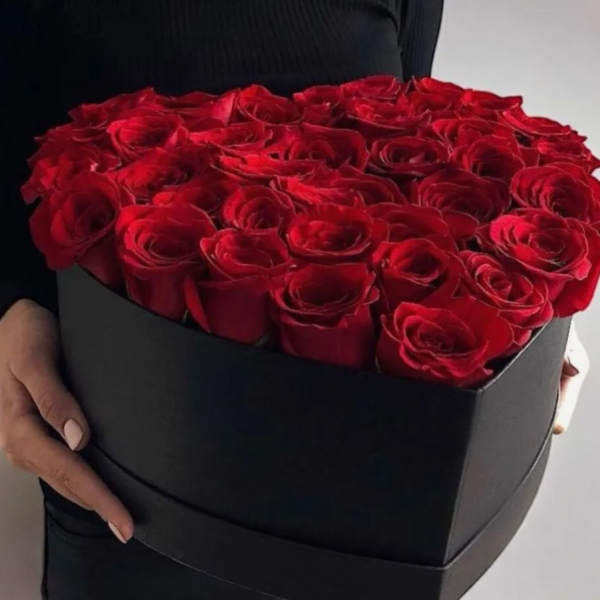Heart-shaped box filled with red roses
