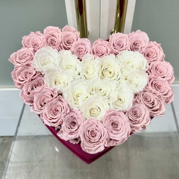 Heart-shaped box of pink and white roses