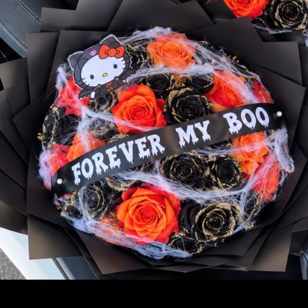 Halloween bouquet of orange and black roses with a "Forever My Boo" banner