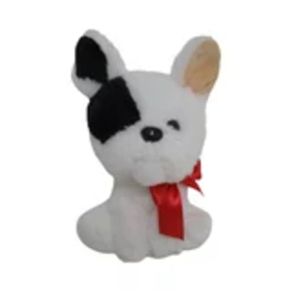 White plush dog with black ear and red ribbon