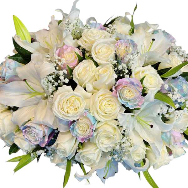 White roses and lilies with pastel-tinted roses in a bouquet