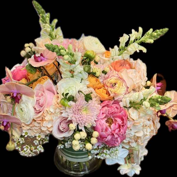 Pastel mixed flower bouquet in a glass vase