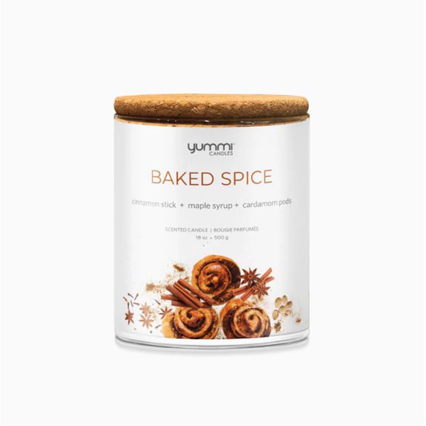 Scented candle in a glass jar with a wooden lid
