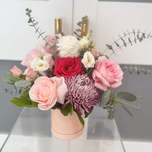Pink and white bouquet in a blush cylindrical box