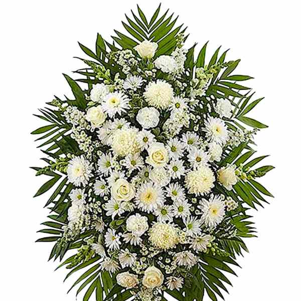 White funeral spray with daisies and roses on a standing easel