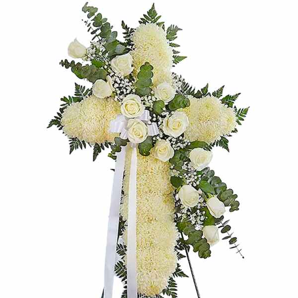 White floral standing cross with roses and ribbon