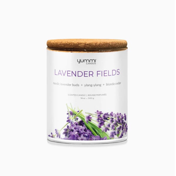 Lavender scented candle in a glass jar with a wooden lid