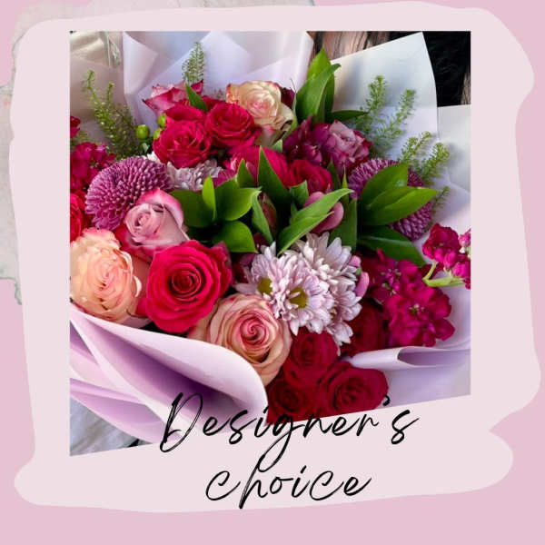 Bouquet of pink and red roses with purple mums in white wrap