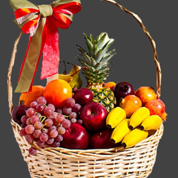 Fruit basket with grapes, apples, bananas, oranges, and a pineapple