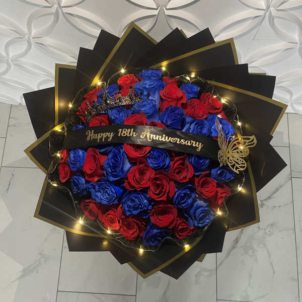 Red and blue rose bouquet with a "Happy 18th Anniversary" ribbon