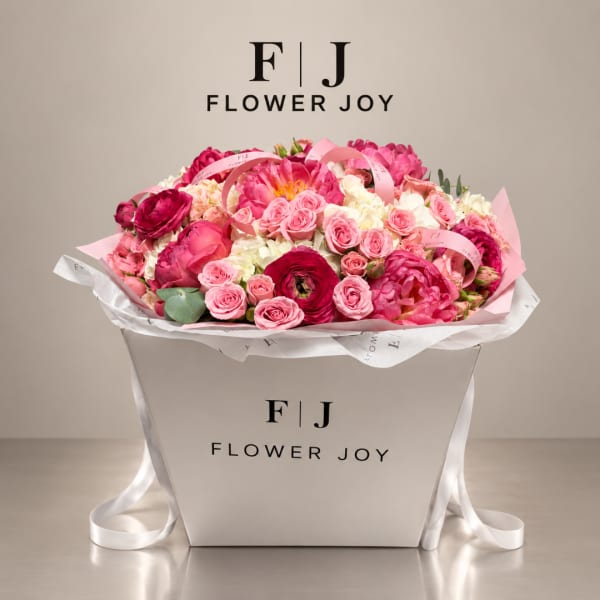 Pink and white mixed flower bouquet in a white gift box