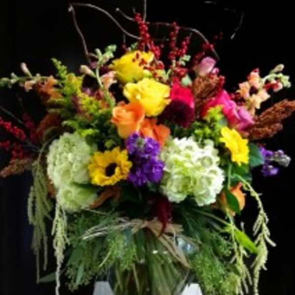 Colorful mixed bouquet in a clear glass vase