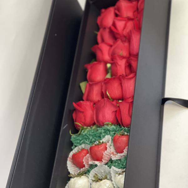 Box of red roses with chocolate-covered strawberries