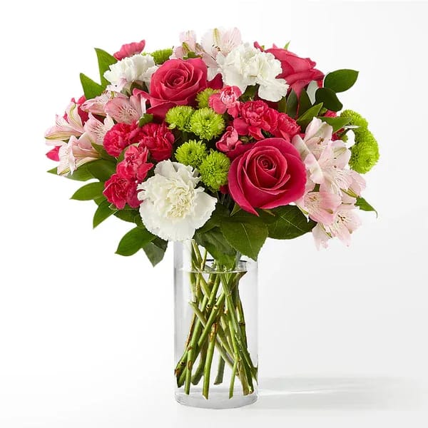 Pink and white mixed bouquet in a clear glass vase