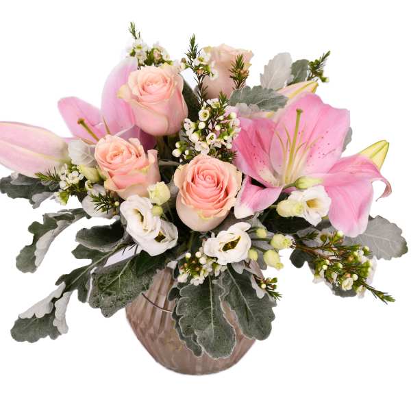 Pink lilies and roses in a glass vase