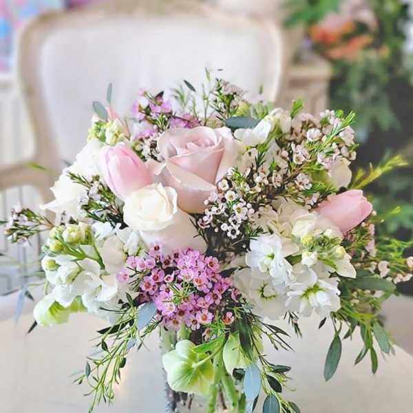 Pink and white bouquet in a clear glass vase