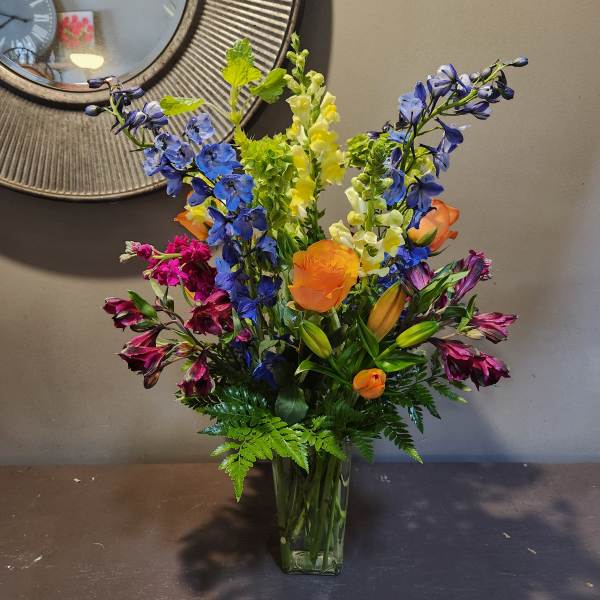 Colorful mixed bouquet in a clear glass vase