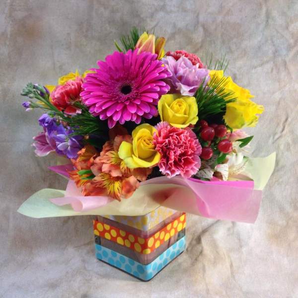 Colorful mixed bouquet in a decorated square box