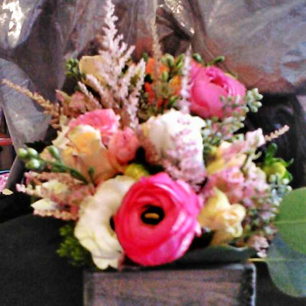 Small mixed bouquet with pink and cream flowers in a square box