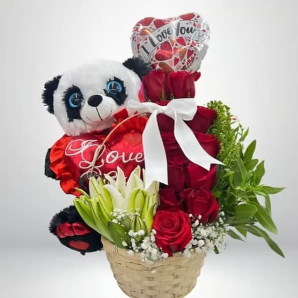 Basket arrangement with red roses, a panda plush, and heart balloons