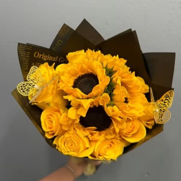 Yellow sunflower and rose bouquet with butterfly decorations