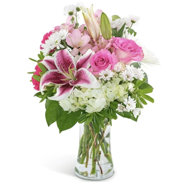 Pink and white mixed bouquet in a clear glass vase