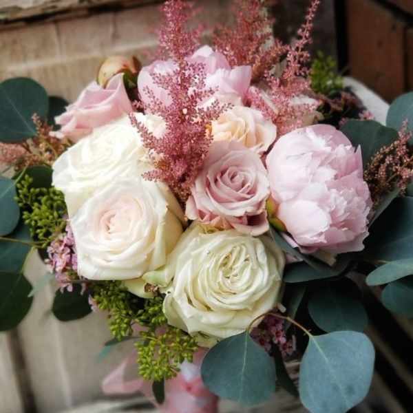Bouquet of blush and white roses with pink filler and eucalyptus