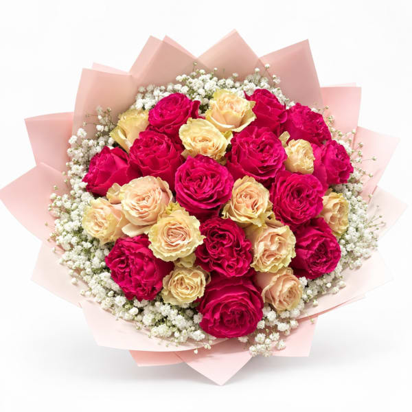 Bouquet of pink and peach roses with white filler flowers