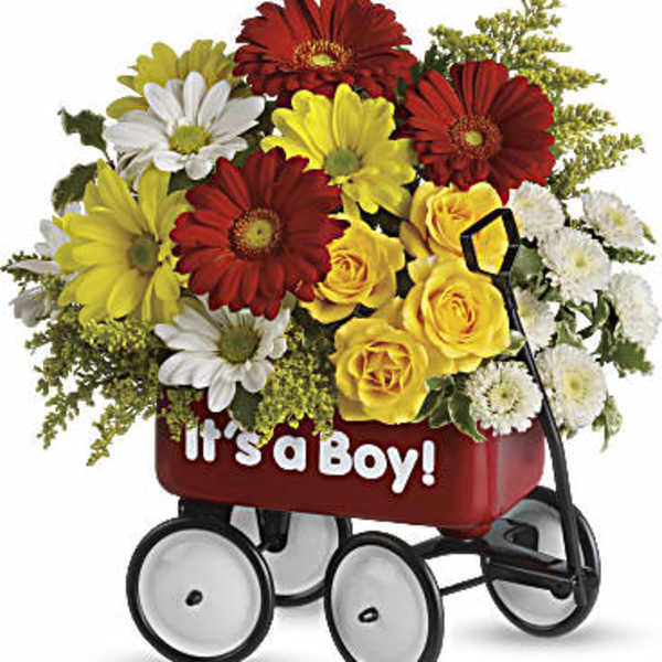 Bouquet of red, yellow, and white flowers in a baby wagon