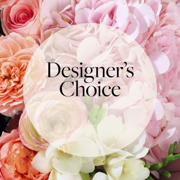Close-up of pink hydrangeas and peach roses with Designer's Choice text overlay