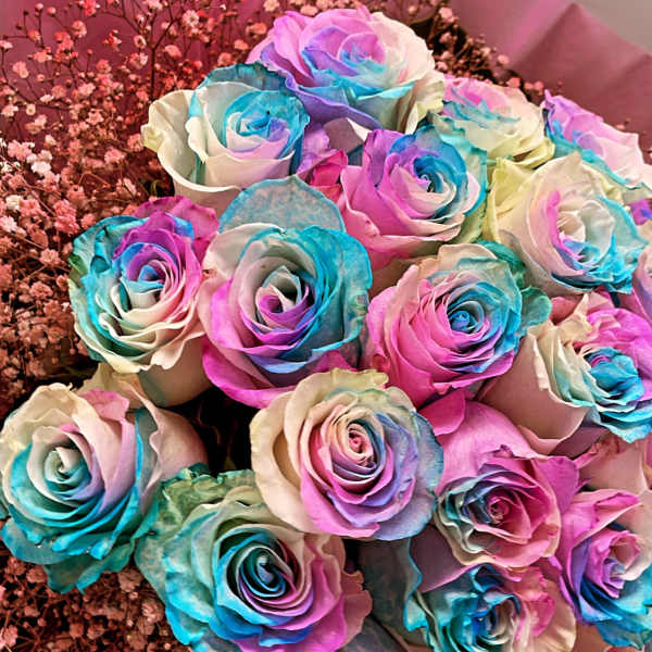 Bouquet of multicolored roses with pink baby's breath
