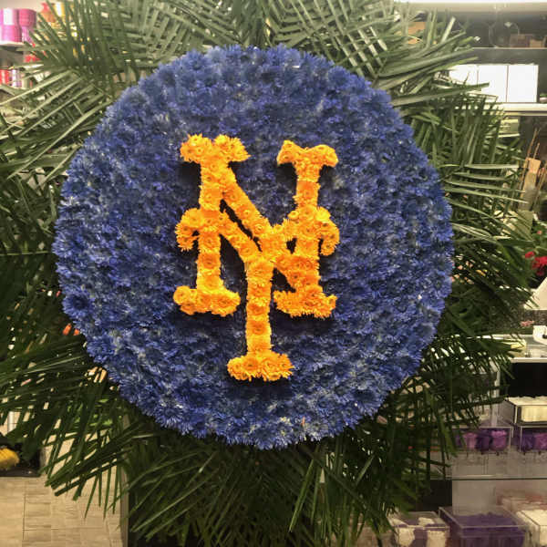 Large blue floral wreath with orange interlocking NY letters