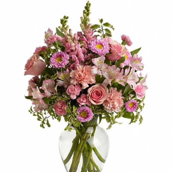 Pink mixed bouquet in a clear glass vase
