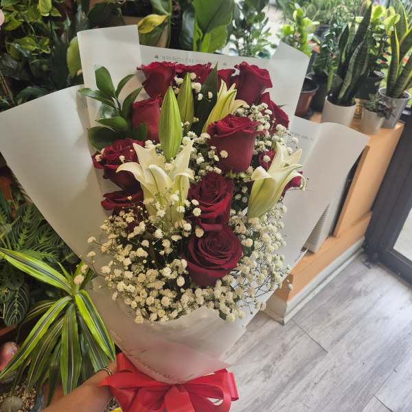 3 lilies and 12 red roses